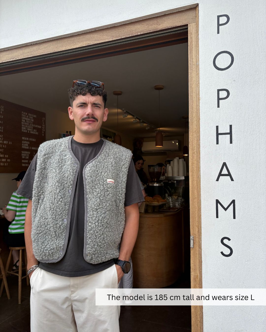 Man wearing a grey merino wool vest by Mewomee, natural merino wool vest for everyday comfort