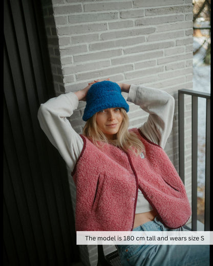 Woman wearing a merino wool vest outdoors, stylish breathable merino wool vest perfect for everyday wear